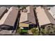 An aerial view highlights a covered patio, desert landscaping, and tile roof at 4012 Shetland Pony St, Las Vegas, NV 89122