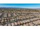 An aerial view showcasing a vast neighborhood with desert landscaping and mountains in the distance at 4012 Shetland Pony St, Las Vegas, NV 89122