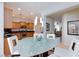 Bright dining area with modern pendant lighting adjacent to the kitchen at 4012 Shetland Pony St, Las Vegas, NV 89122
