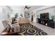 Inviting living room with neutral-toned furnishings, ceiling fan and decorative rug at 4012 Shetland Pony St, Las Vegas, NV 89122
