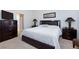 Main bedroom with a large bed, matching bedside tables and dressers at 4012 Shetland Pony St, Las Vegas, NV 89122
