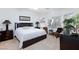 Spacious main bedroom with a large window, furnishings, and a serene atmosphere at 4012 Shetland Pony St, Las Vegas, NV 89122
