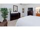 Spacious main bedroom with a dresser and a glimpse into the attached bathroom at 4012 Shetland Pony St, Las Vegas, NV 89122