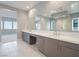 Contemporary bathroom with double sink vanity and a large walk-in shower at 4880 Argento Peak St, Las Vegas, NV 89135