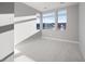 Bright bedroom with neutral carpet and multiple windows offering scenic views at 4880 Argento Peak St, Las Vegas, NV 89135