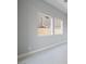 A room with two windows is bright with natural light, walls are neutral and space is ample at 4880 Argento Peak St, Las Vegas, NV 89135