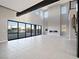 Spacious living room with high ceilings, modern fireplace, and large windows at 4880 Argento Peak St, Las Vegas, NV 89135