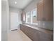 Mud room features extensive cabinets, counter space, natural light, and access to outside at 4880 Argento Peak St, Las Vegas, NV 89135