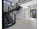 Modern staircase with metal railings and open treads leading to the upper level at 4880 Argento Peak St, Las Vegas, NV 89135