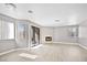 Light-filled living room with a fireplace and large sliding glass doors to the balcony at 5002 S Rainbow Blvd # 101, Las Vegas, NV 89118