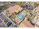 Aerial view of community pool and lounge area surrounded by palm trees at 5002 S Rainbow Blvd # 101, Las Vegas, NV 89118