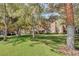 Beautifully landscaped grounds with mature trees and lawns surrounding apartment buildings at 5250 S Rainbow Blvd # 1162, Las Vegas, NV 89118