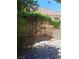 A brick paver pathway leads to a trellis in the backyard at 5830 Springmist St, North Las Vegas, NV 89031