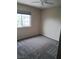 Comfortable bedroom with neutral walls, gray carpet, and ample natural light at 5830 Springmist St, North Las Vegas, NV 89031