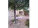 Charming single-story home featuring well-maintained landscaping with a mature tree in the front yard at 5830 Springmist St, North Las Vegas, NV 89031
