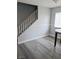 Living room featuring staircase, neutral walls and durable gray flooring at 5830 Springmist St, North Las Vegas, NV 89031