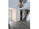 Bright and airy living area with staircase, modern lighting, and durable gray flooring at 5830 Springmist St, North Las Vegas, NV 89031