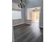 Inviting living room with gray wood floors and abundant natural light at 5830 Springmist St, North Las Vegas, NV 89031