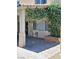 Covered patio with flowering plants and access to the home's interior at 5830 Springmist St, North Las Vegas, NV 89031