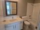 Bathroom featuring white vanity with framed mirror and tub with white subway tile at 6743 W Charleston Blvd # 4, Las Vegas, NV 89146