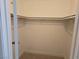 A reach-in closet with neutral carpeting and white walls at 6743 W Charleston Blvd # 4, Las Vegas, NV 89146
