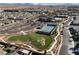 Aerial view of a Primary-planned community with pool, tennis courts, dog park, and well-maintained landscaping at 6756 Millbury St, North Las Vegas, NV 89086