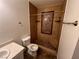 Nicely updated bathroom featuring tiled shower and modern fixtures, and tile floors at 7046 Royal Meadow Pl, Las Vegas, NV 89147