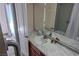 Well-lit bathroom featuring a vanity with marble countertops and a tiled shower at 714 Oakmont Ave # 1107, Las Vegas, NV 89109