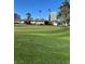 Lush community golf course surrounded by green grass, mature trees, and residential buildings at 714 Oakmont Ave # 1107, Las Vegas, NV 89109