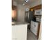 Clean kitchen featuring stainless steel refrigerator and tile flooring at 714 Oakmont Ave # 1107, Las Vegas, NV 89109