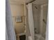 Bathroom showcasing a shower with beige tile and accessibility bars at 714 Oakmont Ave # 1107, Las Vegas, NV 89109