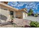Inviting front entrance with a beautiful stone walkway and lush landscaping leading to a well-maintained home at 7724 Clearwood Ave, Las Vegas, NV 89123