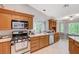 Well-maintained kitchen featuring granite countertops, stainless steel appliances, and ample cabinet space at 7724 Clearwood Ave, Las Vegas, NV 89123