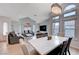 Bright and airy living room featuring a modern chandelier, large windows, and open floor plan at 7724 Clearwood Ave, Las Vegas, NV 89123