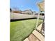 Fully fenced backyard featuring artificial grass at 8461 Faucet Ave, Las Vegas, NV 89147