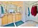 Bright bathroom features a double vanity and a large mirror at 8461 Faucet Ave, Las Vegas, NV 89147