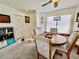 Dining room features a window seat and carpeted floors at 8461 Faucet Ave, Las Vegas, NV 89147