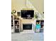 Close up of the fireplace with shelving on either side at 8461 Faucet Ave, Las Vegas, NV 89147