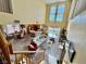 Open floor plan with large windows, a spacious living room, dining area, and connected kitchen at 8461 Faucet Ave, Las Vegas, NV 89147