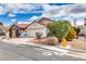 Charming single-story home featuring a well-maintained front yard and attached two-car garage at 8566 Manalang Rd, Las Vegas, NV 89123