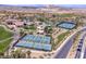 Community amenities include tennis courts, pool, clubhouse, and golf course against a desert backdrop at 9 Promenade Isle Ln, Henderson, NV 89011