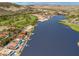 Panoramic aerial view of luxury homes along waterfront, golf course and swimming pools at 9 Promenade Isle Ln, Henderson, NV 89011