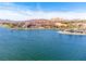 Breathtaking aerial view of the lake and the resort with golf course and residential areas at 9 Promenade Isle Ln, Henderson, NV 89011