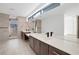 Modern primary bathroom with double vanities, shower, and light-filled design at 9 Promenade Isle Ln, Henderson, NV 89011