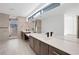 Modern bathroom features dual sinks, dark wood cabinets, and a glass shower at 9 Promenade Isle Ln, Henderson, NV 89011