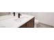 Modern bathroom vanity with quartz countertop, undermount sink, modern faucet, and coordinating fixtures at 9 Promenade Isle Ln, Henderson, NV 89011