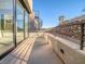 Modern home features a large patio area with a spiral staircase and rock wall at 9 Promenade Isle Ln, Henderson, NV 89011