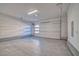Spacious garage with a modern door and concrete floor at 9 Promenade Isle Ln, Henderson, NV 89011