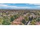 An aerial view of neighborhood surrounded by mature trees at 9044 Opus Dr, Las Vegas, NV 89117