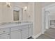 Bathroom featuring vanity with marble top, subway tile backsplash, and modern fixtures at 9044 Opus Dr, Las Vegas, NV 89117